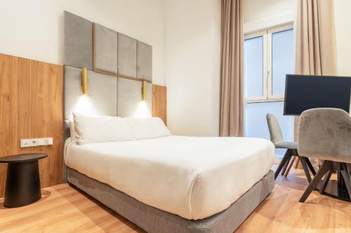 Ένα ή περισσότερα κρεβάτια σε δωμάτιο στο Limehome San Sebastian Zubieta Kalea