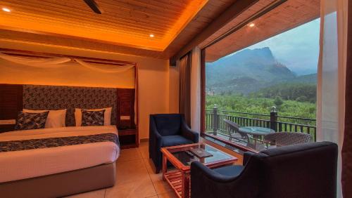 a bedroom with a bed and a balcony with a view at Nazaara - A Luxe Retreat in Manāli