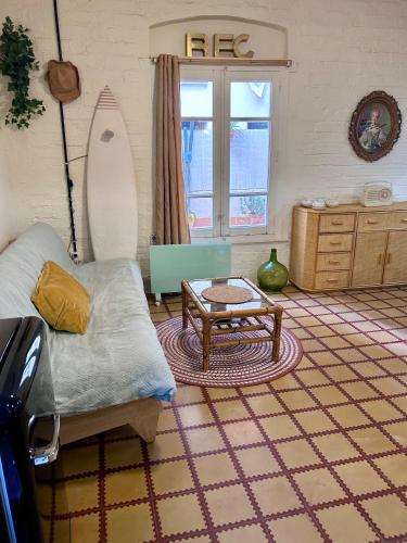 a living room with a couch and a table at Loft con patio en la zona de tapas Pet Friendly in Logroño