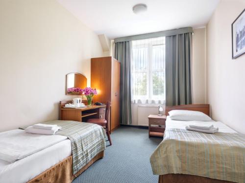 Postel nebo postele na pokoji v ubytování Hotel Galicya
