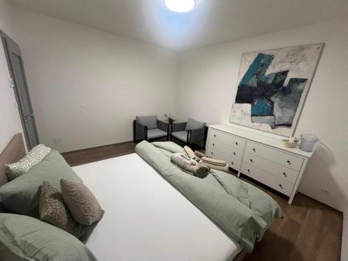 a living room with a couch and a dresser at Vila EMMA in Prostějov