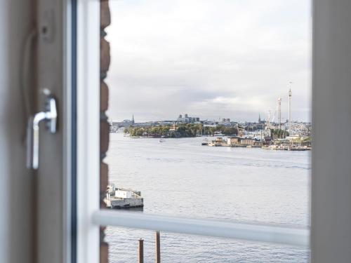 a view of a river from a window at Elite Hotel Marina Tower, Spa & Resort in Stockholm