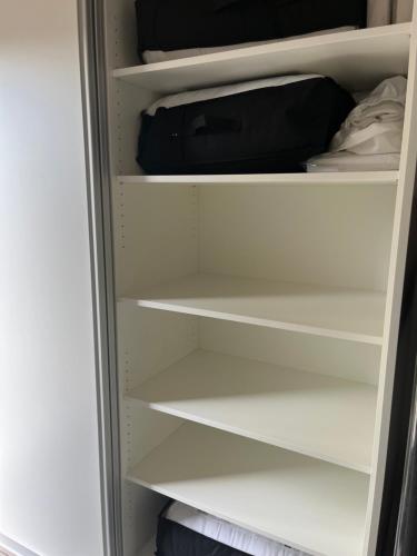 a white refrigerator with its door open at chaletje tis-ier-goed in Jabbeke