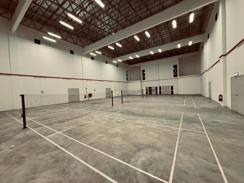 an empty tennis court in a large building at Ipoh Midtown Anderson Suite 2R2B in Ipoh