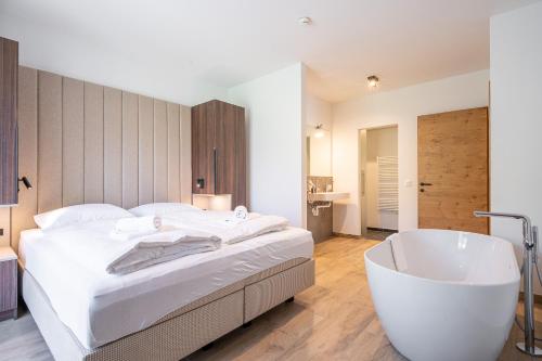 Alpenzauber Apartments by Montevivaにあるベッド