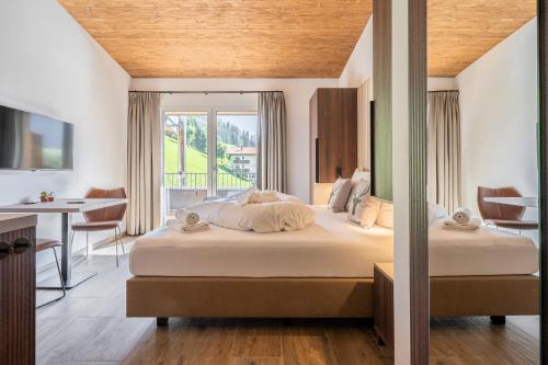 Alpenzauber Apartments by Montevivaにあるベッド