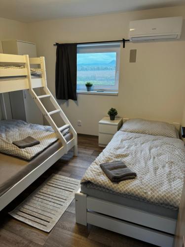 Postel nebo postele na pokoji v ubytování Apartmán 2 Jägerhaus