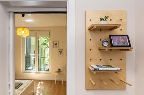 a room with a wall with a laptop on a shelf at Peaceful retreat - free parking in Plovdiv