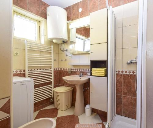 Kúpeľňa v ubytovaní Apartments Snjeza