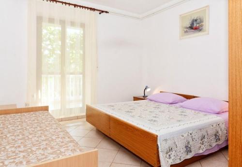 Posteľ alebo postele v izbe v ubytovaní Apartments Snjeza