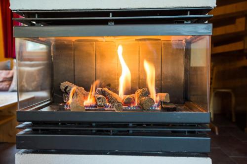 a oven with some food cooking in it at Alpendorf Dachstein West by ALPS RESORTS in Annaberg im Lammertal