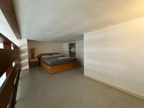 Ένα ή περισσότερα κρεβάτια σε δωμάτιο στο Appartement Quais de Grenoble