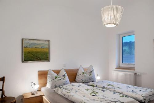 a bedroom with a bed and a window at Sand 68 in Steinau an der Straße