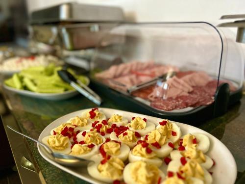 a plate of food on top of a counter at Riviera 990 - Resort & Restaurant in Eşelniţa