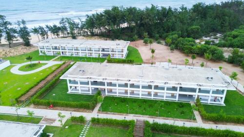 an aerial view of a building next to the ocean at SBH Gloria Hue in Hue