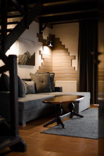 a living room with a couch and a coffee table at Hotel 4x4 in Rivne