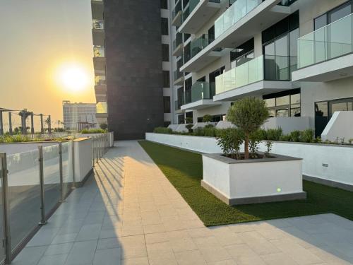 a balcony of a building with a potted plant at Ashri Elegant Studio Near Burj Khalifa in Dubai