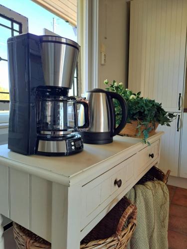 a coffee maker on top of a table at Østby Trysil luxury holiday home in Trysil