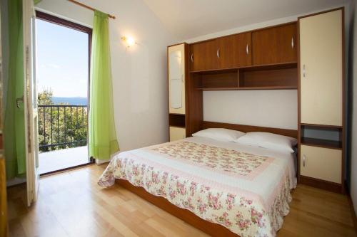 Posteľ alebo postele v izbe v ubytovaní Apartments Ana