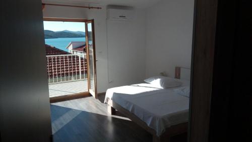 Posteľ alebo postele v izbe v ubytovaní Apartment Marijica