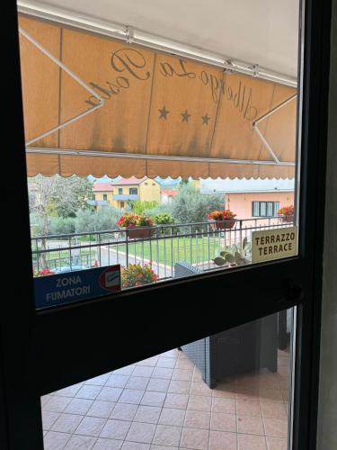 a view through a glass door of a building at Albergo La Posta Arezzo in Badia Al Pino