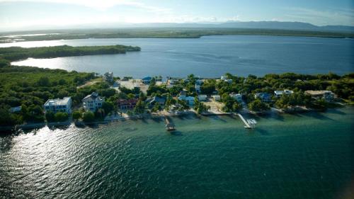 an aerial view of a small island in the water at Casa de Wilson - 5 Bedroom Beachfront Villa in Maya Beach