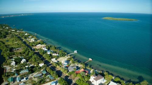 an aerial view of a beach and the ocean at Casa de Wilson - 5 Bedroom Beachfront Villa in Maya Beach