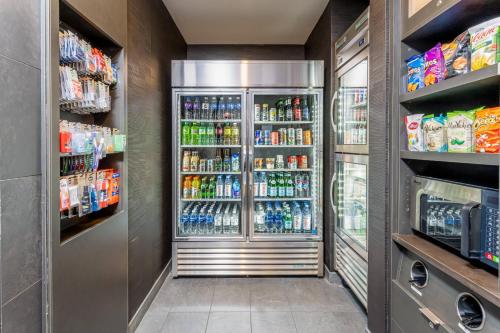 a refrigerator filled with lots of drinks in a store at Courtyard Asheville Biltmore Village in Asheville
