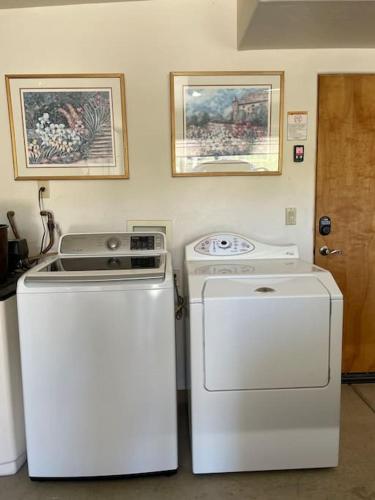 a kitchen with a stove and a washer and dryer at Tucson Mnt Foothills Saguaro Bliss in Tucson
