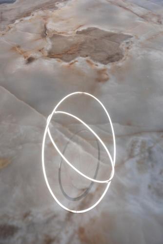 a white circle in the middle of the water at J Maluni City Hotel in Rome