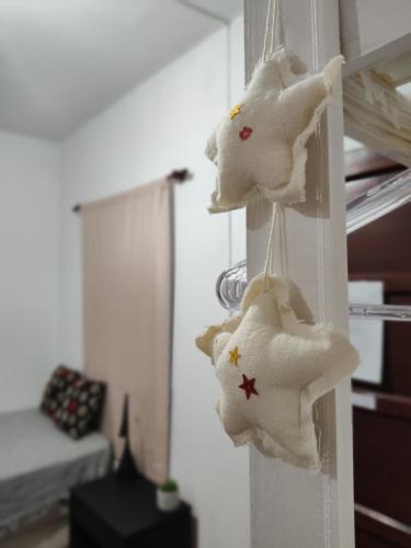 a room with some cookies hanging on a wall at 866 Apart in San Fernando del Valle de Catamarca