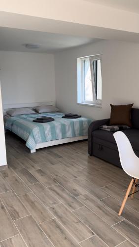 Ένα ή περισσότερα κρεβάτια σε δωμάτιο στο SoNa apartments