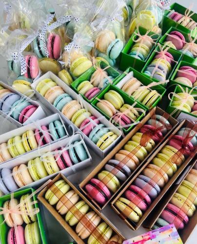 a display of different colored pastries in boxes at Hotel Neyün La Junta in La Junta