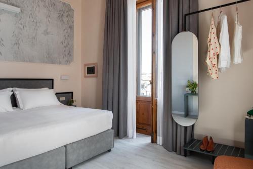 Postel nebo postele na pokoji v ubytování Hotel Fiorita