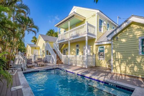 a house with a swimming pool in front of a house at Chagall's Corner in Key West