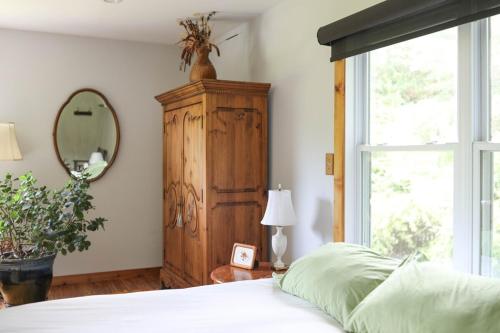 Katil atau katil-katil dalam bilik di Blue Rivers Cottage & Loft