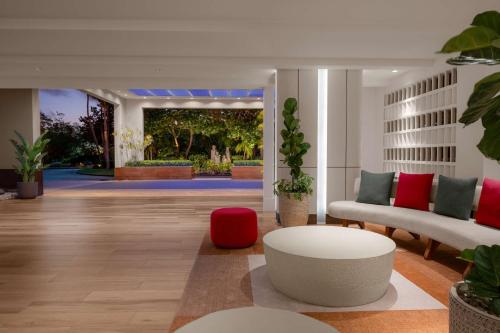 a living room with a couch and a table at Hilton Aruba Caribbean Resort & Casino in Palm-Eagle Beach