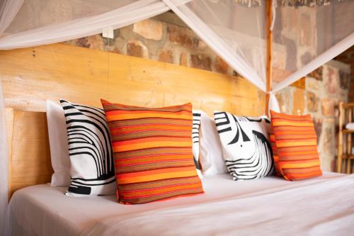 Voodi või voodid majutusasutuse Akagera Rhino Lodge toas