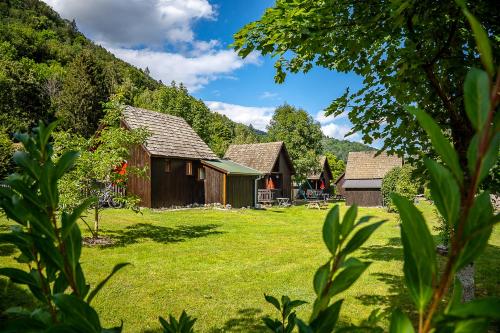 a group of cottages in a field with grass at Chalets de la Wormsa in Metzeral