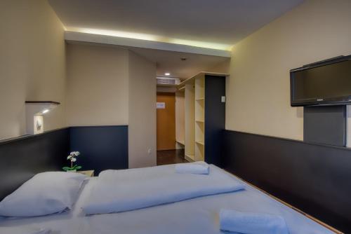 Кровать или кровати в номере City Budget Hotel