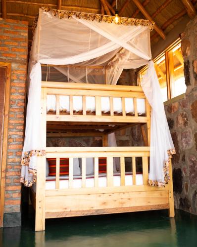 Voodi või voodid majutusasutuse Akagera Rhino Lodge toas