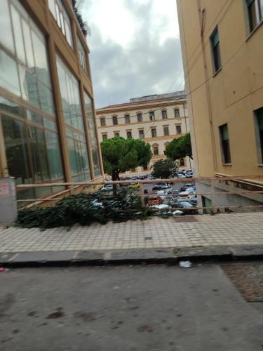 a group of buildings with a parking lot with cars at San vito 9 in Agrigento