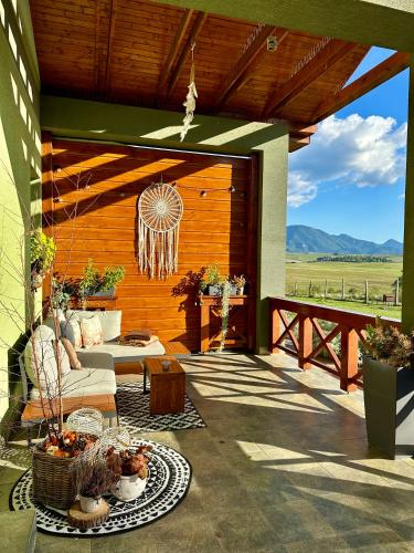 an outdoor patio with a couch and a table at Apartmán Ranč in Martin