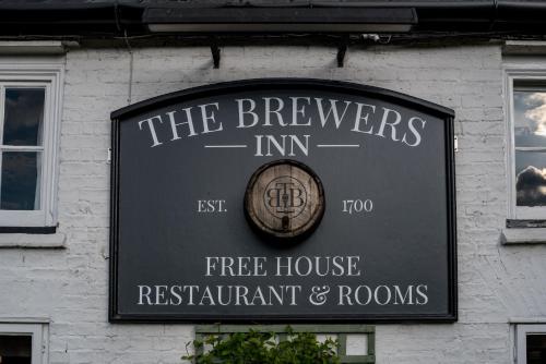 a sign for the brewers inn on the side of a building at Brewers Inn in Cambridge
