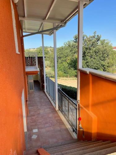 an empty balcony of a house with a view at Nel cuore del Parco in Montebello di Bertona