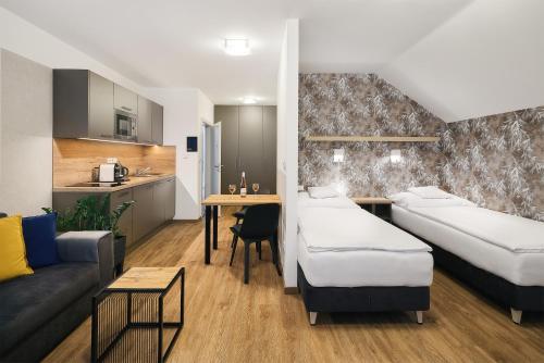 Postel nebo postele na pokoji v ubytování Apartmány Benedicta