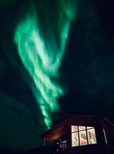 an image of the northern lights in the sky at Villa Arctic in Tromsø