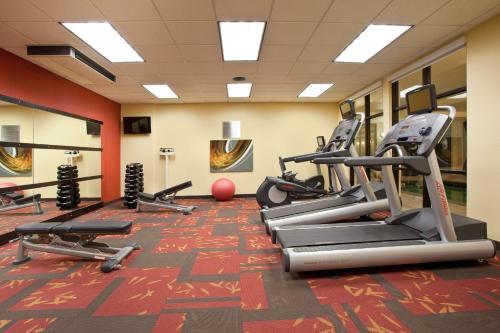 a gym with treadmills and exercise equipment on the floor at Courtyard Grand Junction in Grand Junction