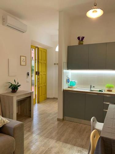 a kitchen with a sink and a counter top at Nuovissimo a 300 mt dalle Mura con posto auto in Lucca