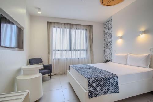 Katil atau katil-katil dalam bilik di Nacional Inn Palmas
